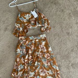 Two piece tan island set crop top with shorts/ skirt . size large-